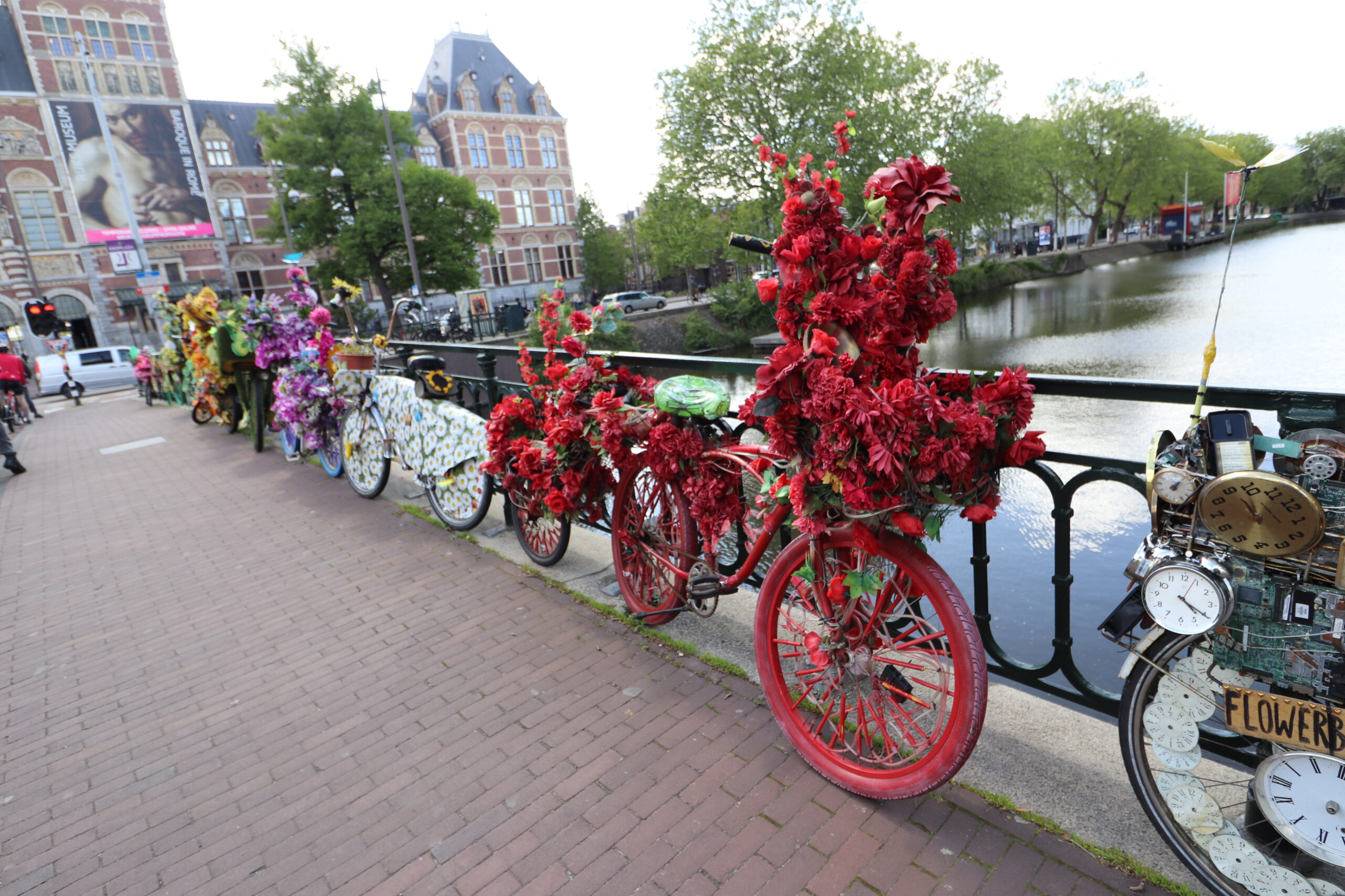 bikes, flowerbikes, amsterdam, bridge, rijksmuseum, museumplein, canals, water, bicycle, bicycles, riding, flowers